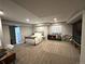 Finished basement with carpet flooring, and a bedroom area at 6834 Clay N St, Denver, CO 80221