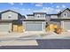 Home exterior featuring a gray garage door and matching exterior siding at 6834 Clay N St, Denver, CO 80221