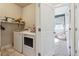 Laundry area with washer and dryer, shelving, and ample storage at 6834 Clay N St, Denver, CO 80221
