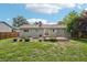 View of the backyard with a well-maintained lawn and exterior of the home, showcasing its outdoor space at 4759 S Xenophon St, Morrison, CO 80465