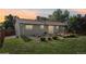 The home's backyard features a deck and garden beds, offering space for relaxation and gardening projects at 4759 S Xenophon St, Morrison, CO 80465
