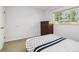 Bedroom featuring natural light from a large window, along with a dark dresser at 4759 S Xenophon St, Morrison, CO 80465