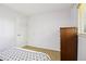 Bedroom featuring natural light from a large window, along with a dark dresser at 4759 S Xenophon St, Morrison, CO 80465