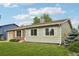 Charming single-story home featuring a well-manicured lawn, brick accents, and white-trimmed windows at 4759 S Xenophon St, Morrison, CO 80465