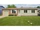 Charming single-story home featuring a well-manicured lawn, brick accents, and a convenient attached garage at 4759 S Xenophon St, Morrison, CO 80465
