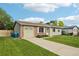 Charming single-story home featuring a well-manicured lawn, brick accents, and a convenient attached garage at 4759 S Xenophon St, Morrison, CO 80465