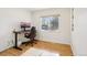 Home office space with hardwood floors, desk, and ample natural light for remote work at 4759 S Xenophon St, Morrison, CO 80465