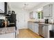 Kitchen with stainless steel appliances, granite countertops, and ample cabinet space at 4759 S Xenophon St, Morrison, CO 80465