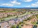 Expansive aerial view of a neighborhood with mountain views, showcasing the community layout and surrounding landscape at 2208 Bellavista St, Castle Rock, CO 80109