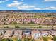 Sweeping aerial perspective of a sprawling residential area nestled against a mountain backdrop at 2208 Bellavista St, Castle Rock, CO 80109