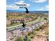 Aerial view of a two-story home with solar panels, a trampoline, and easy access to a community pool at 2208 Bellavista St, Castle Rock, CO 80109