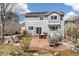 Backyard featuring a stone patio with dining, a barbeque, and egg chair swings, perfect for outdoor living at 2208 Bellavista St, Castle Rock, CO 80109