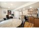 Finished basement featuring a kitchenette, bar, and table at 2208 Bellavista St, Castle Rock, CO 80109