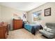 Bedroom with a large sunny window and comfortable chair at 2208 Bellavista St, Castle Rock, CO 80109