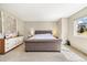 Bright and airy bedroom with a large bed, dresser, and ample natural light at 2208 Bellavista St, Castle Rock, CO 80109