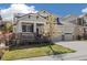 Attractive two-story home with a three-car garage, covered porch, and lush landscaping at 2208 Bellavista St, Castle Rock, CO 80109