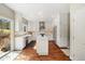Modern kitchen featuring stainless steel appliances, a center island, and white cabinetry at 2208 Bellavista St, Castle Rock, CO 80109