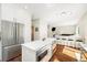 Stylish kitchen featuring stainless steel refrigerator and modern island with barstool seating at 2208 Bellavista St, Castle Rock, CO 80109