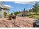 Spacious outdoor patio with a heater, dining table, and comfortable egg chair swings; great for entertaining at 2208 Bellavista St, Castle Rock, CO 80109
