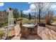 Outdoor patio with a dining table, wicker chairs, and heater for entertaining in a serene setting at 2208 Bellavista St, Castle Rock, CO 80109