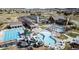 Aerial view of the community pool area with slides, lap pool, and lounge chairs at 2208 Bellavista St, Castle Rock, CO 80109
