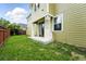Backyard featuring a concrete patio and well-maintained lawn at 2648 Florence St, Denver, CO 80238