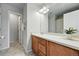 Bathroom features wood cabinets, tile floors, and a large vanity at 2648 Florence St, Denver, CO 80238