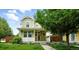 Charming two-story home with landscaped front yard, inviting porch, and appealing curb appeal at 2648 Florence St, Denver, CO 80238