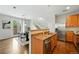 Well-designed kitchen area with stainless steel appliances that seamlessly connects to the dining area at 2648 Florence St, Denver, CO 80238