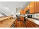 Open kitchen with stainless steel appliances, wood floors, and plenty of cabinet space at 2648 Florence St, Denver, CO 80238