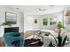 Stylish living room featuring hardwood floors, neutral colors, and large windows for ample light at 2648 Florence St, Denver, CO 80238