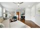 Bright open-concept living room with modern furnishings, hardwood floors, and abundant natural light at 2648 Florence St, Denver, CO 80238