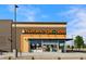 Exterior shot of the modern architecture and storefront for Natural Grocers market at 2648 Florence St, Denver, CO 80238