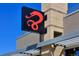 A unique red snake design on a black square representing a local restaurant at 2648 Florence St, Denver, CO 80238