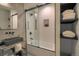 Modern bathroom with a gray trough sink, sleek black fixtures, and glass-enclosed shower at 563 Cr 672, Breckenridge, CO 80424