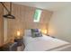 Charming bedroom with skylight, wood-paneled walls, and a comfy king-size bed at 563 Cr 672, Breckenridge, CO 80424