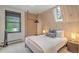 Bright bedroom with a window view and wood-paneled walls, creating a cozy and inviting space at 563 Cr 672, Breckenridge, CO 80424