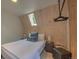 Bedroom featuring skylight, wood-paneled walls, and a comfy king-size bed with bedside tables at 563 Cr 672, Breckenridge, CO 80424