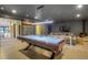 Spacious game room with a pool table, entertainment area, and modern lighting fixture at 563 Cr 672, Breckenridge, CO 80424