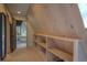 Hallway features built-in wooden shelves and door that leads to a window with a view at 563 Cr 672, Breckenridge, CO 80424