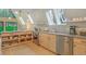 Charming kitchen with wooden cabinets, stainless steel appliances, open shelving, and large windows for natural light at 563 Cr 672, Breckenridge, CO 80424