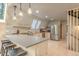 Modern kitchen with stainless steel appliances, breakfast bar seating, ample countertop space, and built-in wine rack at 563 Cr 672, Breckenridge, CO 80424