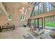 Bright living room with floor-to-ceiling windows, wood accents, and modern furnishings at 563 Cr 672, Breckenridge, CO 80424