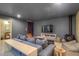 Cozy living room with a wood-burning stove, comfortable seating, and modern entertainment center at 563 Cr 672, Breckenridge, CO 80424