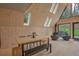 Dining and living space features natural wood, vaulted ceilings, modern decor, and large windows offering views of the outdoors at 563 Cr 672, Breckenridge, CO 80424