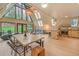 Open-concept living space with vaulted ceilings, natural lighting, modern furnishings and seamless indoor/outdoor transition at 563 Cr 672, Breckenridge, CO 80424