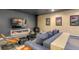 Relaxing living room boasts a wood-burning stove, modern TV, and cozy gray sofa with a wood table at 563 Cr 672, Breckenridge, CO 80424