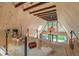 Cozy loft area featuring glass railings and comfortable seating, offering a relaxing space with an elevated view at 563 Cr 672, Breckenridge, CO 80424