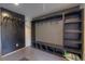Mudroom area features dark storage cubbies, hooks, and tile floors at 563 Cr 672, Breckenridge, CO 80424