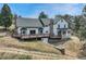 A spacious deck extends from the house, offering a place to relax and enjoy the outdoors at 9310 S Watson Gulch Rd, Littleton, CO 80127